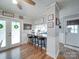 Charming eat-in kitchen featuring a breakfast bar, white cabinets, and wood-look floors at 335 Linda St, Salisbury, NC 28146