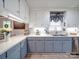 Updated kitchen showcasing quartz counters, two-tone cabinets, and modern fixtures at 335 Linda St, Salisbury, NC 28146