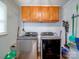 Functional laundry room featuring modern appliances, storage cabinets, and convenient layout at 335 Linda St, Salisbury, NC 28146