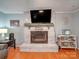 Living room with a fireplace, TV, and hardwood floors at 335 Linda St, Salisbury, NC 28146