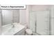 Bathroom featuring a shower with a glass door and a white sink at 3412 Lacebark Ln, Gastonia, NC 28056