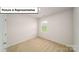 Carpeted bedroom with a window and door at 3412 Lacebark Ln, Gastonia, NC 28056