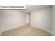The bedroom is carpeted and has a white door for privacy, creating a cozy and inviting space at 3412 Lacebark Ln, Gastonia, NC 28056