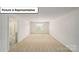 Spacious, carpeted bedroom bathed in natural light from a window, offering a serene living space at 3412 Lacebark Ln, Gastonia, NC 28056
