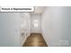 Inviting entryway featuring hardwood floors, a glass paneled front door, and French doors at 3412 Lacebark Ln, Gastonia, NC 28056