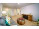 Spacious living room featuring a comfortable sofa, stylish coffee table, and ample natural light at 3414 Lacebark Ln, Gastonia, NC 28056