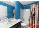 Bathroom with a vanity, toilet, and butterfly-themed shower curtain at 3424 Windstone Ln, Gastonia, NC 28056