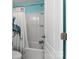 Bathroom with a peacock themed shower curtain, bathtub, and a toilet at 3424 Windstone Ln, Gastonia, NC 28056