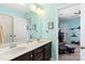 Bathroom featuring a double vanity, framed mirror, and light fixtures at 3424 Windstone Ln, Gastonia, NC 28056