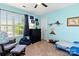 bedroom with dinosaur decor, a dresser, and a comfortable chair at 3424 Windstone Ln, Gastonia, NC 28056