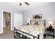 Cozy bedroom features a colorful floral quilt, bedside lamps, and soft carpet at 3424 Windstone Ln, Gastonia, NC 28056