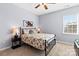 Cozy bedroom with natural light, neutral carpet and a decorative metal headboard at 3424 Windstone Ln, Gastonia, NC 28056