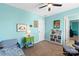 Bedroom with dinosaur-themed decor, a bookshelf, and a twin bed at 3424 Windstone Ln, Gastonia, NC 28056
