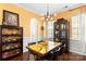 Bright dining room features a unique table and chairs, decorative lighting, and ample storage at 3424 Windstone Ln, Gastonia, NC 28056