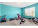 Bright exercise room with fitness equipment, weights, and large window at 3424 Windstone Ln, Gastonia, NC 28056
