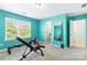 Exercise room with weight bench and rowing machine near a bright window at 3424 Windstone Ln, Gastonia, NC 28056