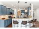 Stylish kitchen features a breakfast bar, granite counters, stainless appliances, and plenty of room for bar stools at 3424 Windstone Ln, Gastonia, NC 28056