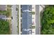 Aerial view of townhomes with gray roofs, small back patios, and an attractive landscape at 355 S Bruns Ave, Charlotte, NC 28208