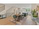 Bright, open dining area with modern table, chairs, and stylish decor, adjacent to the open kitchen at 355 S Bruns Ave, Charlotte, NC 28208