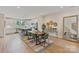 Bright dining area featuring a wood table, modern decor, open to the gourmet kitchen and a great view at 355 S Bruns Ave, Charlotte, NC 28208