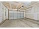 Spacious two car garage with neutral walls ready to be converted into a workshop or for parking at 355 S Bruns Ave, Charlotte, NC 28208