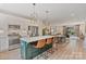 Open kitchen with island seating, stainless steel appliances, and easy access to the dining and living areas at 355 S Bruns Ave, Charlotte, NC 28208
