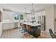 Well-lit kitchen featuring stainless steel appliances, white countertops, and a large island with seating at 355 S Bruns Ave, Charlotte, NC 28208
