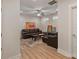 Comfortable living room with a brown leather sofa, ceiling fan, and modern decor at 355 S Bruns Ave, Charlotte, NC 28208