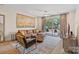 Cozy living room featuring a large sectional, stylish decor, and access to the balcony, and hardwood floors at 355 S Bruns Ave, Charlotte, NC 28208