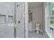 Modern bathroom with a glass shower and a white vanity with gray floors at 4006 Scarlet Dr # 29, Matthews, NC 28104