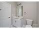 This bathroom features a white vanity with a light countertop and gray floors at 4006 Scarlet Dr # 29, Matthews, NC 28104