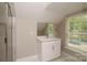 Bright bathroom with a new vanity, granite countertops, and a modern shower with glass doors at 4006 Scarlet Dr # 29, Matthews, NC 28104
