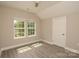 Cozy bedroom with ample natural light, featuring neutral walls and modern flooring at 4006 Scarlet Dr # 29, Matthews, NC 28104
