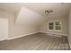 Bright bedroom with neutral walls, modern ceiling fan, and large windows offering views of the outside at 4006 Scarlet Dr # 29, Matthews, NC 28104