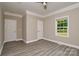 This bedroom features gray floors, neutral walls, and two entry doors at 4006 Scarlet Dr # 29, Matthews, NC 28104
