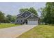 Charming two-story home with a well-manicured lawn and long driveway at 4006 Scarlet Dr # 29, Matthews, NC 28104
