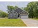 Charming two-story home with a well-manicured lawn and attached two-car garage at 4006 Scarlet Dr # 29, Matthews, NC 28104