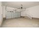 View of a well-lit garage with door, offering ample parking and storage with convenient overhead lighting at 4006 Scarlet Dr # 29, Matthews, NC 28104
