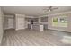 Open concept living room with gray floors and gray kitchen at 4006 Scarlet Dr # 29, Matthews, NC 28104