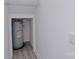A utilitarian storage area equipped with a water heater and wire shelving, ideal for organized storage solutions at 4006 Scarlet Dr # 29, Matthews, NC 28104