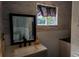 Bathroom vanity with a white sink, dark faucet, and framed mirror at 403 3Rd Nw St, Conover, NC 28613