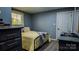 This bedroom offers a great space with wooden floors, lots of natural light and neutral blue walls at 403 3Rd Nw St, Conover, NC 28613