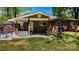Covered patio with seating, gas grill, and access to the backyard at 403 3Rd Nw St, Conover, NC 28613