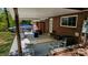 The covered brick patio features seating, a gas grill, and access to the backyard at 403 3Rd Nw St, Conover, NC 28613
