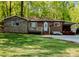 Charming brick home with stone accents, a carport, and a well-maintained front yard at 403 3Rd Nw St, Conover, NC 28613