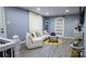 Cozy living room with wood floors, large sofa, and sliding door for natural light at 403 3Rd Nw St, Conover, NC 28613
