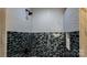 Shower features decorative tile and a black shower head at 403 3Rd Nw St, Conover, NC 28613