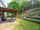 Grassy backyard with a pergola, stairs to upper area, and privacy fence at 4148 Shasta Cir, Clover, SC 29710
