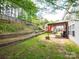 Fenced backyard with pergola, storage shed, and terraced landscaping at 4148 Shasta Cir, Clover, SC 29710