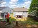 View of a spacious backyard with a patio, shed, and well-maintained lawn, perfect for outdoor activities and relaxation at 4148 Shasta Cir, Clover, SC 29710